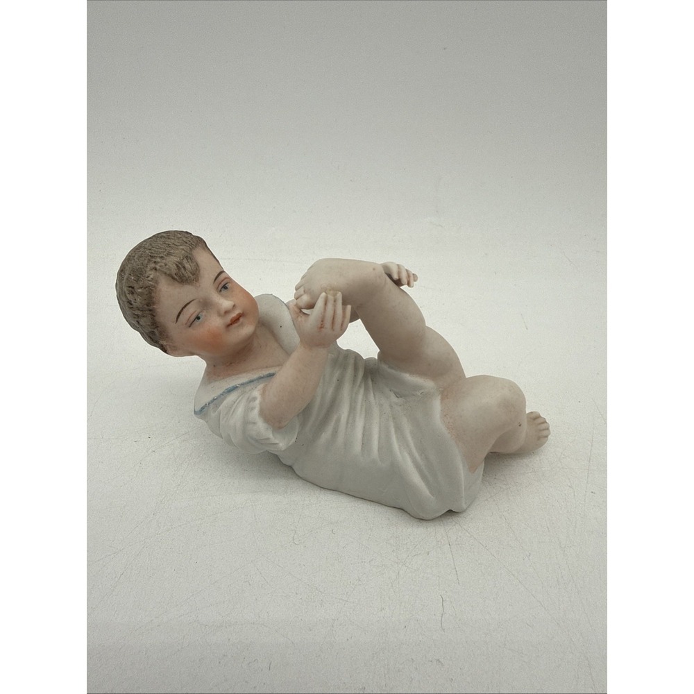Vintage Bisque Piano Baby Toddler Playing With Feet Figurine